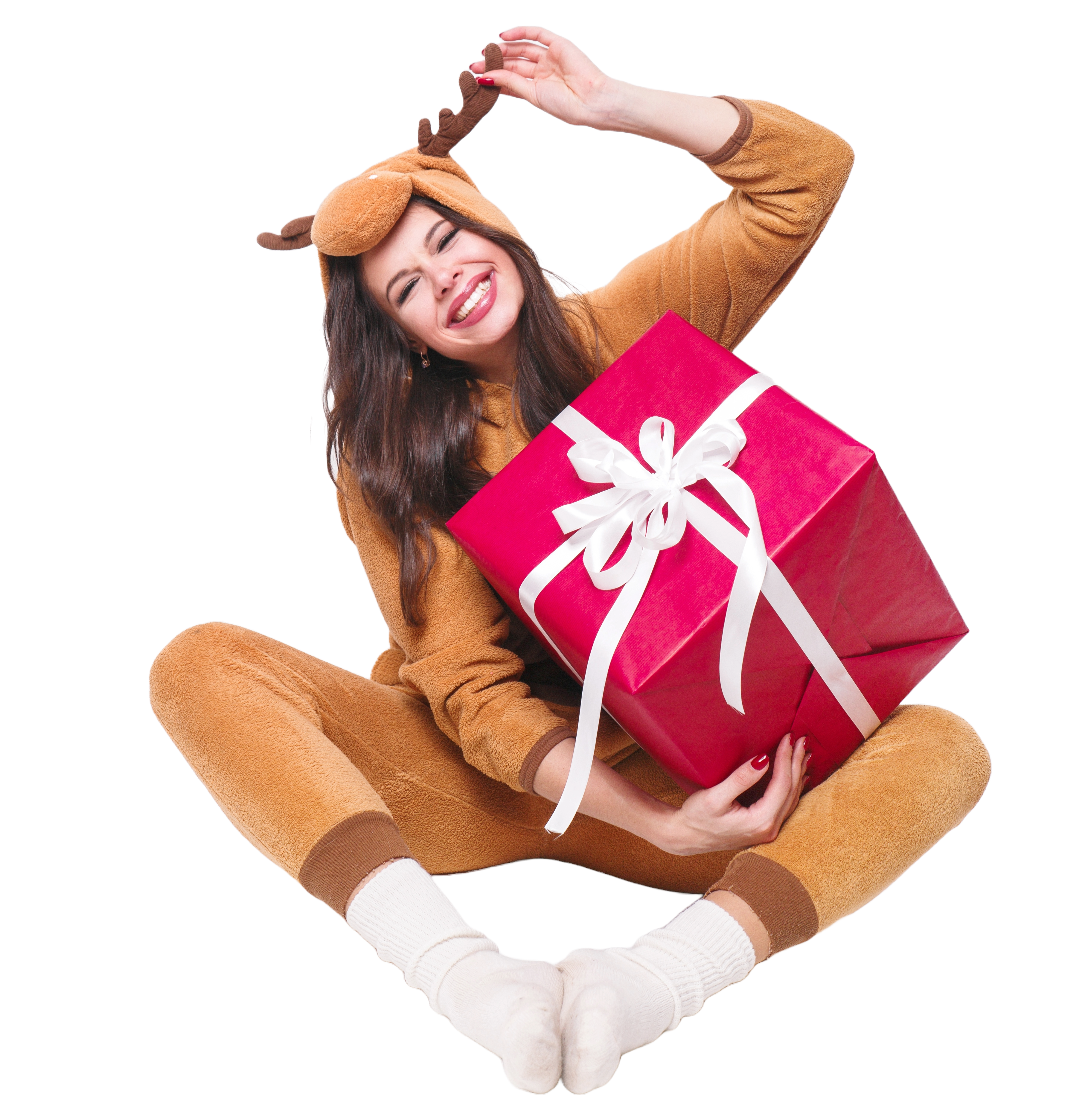 Smiling woman in a reindeer onesie holding a gift